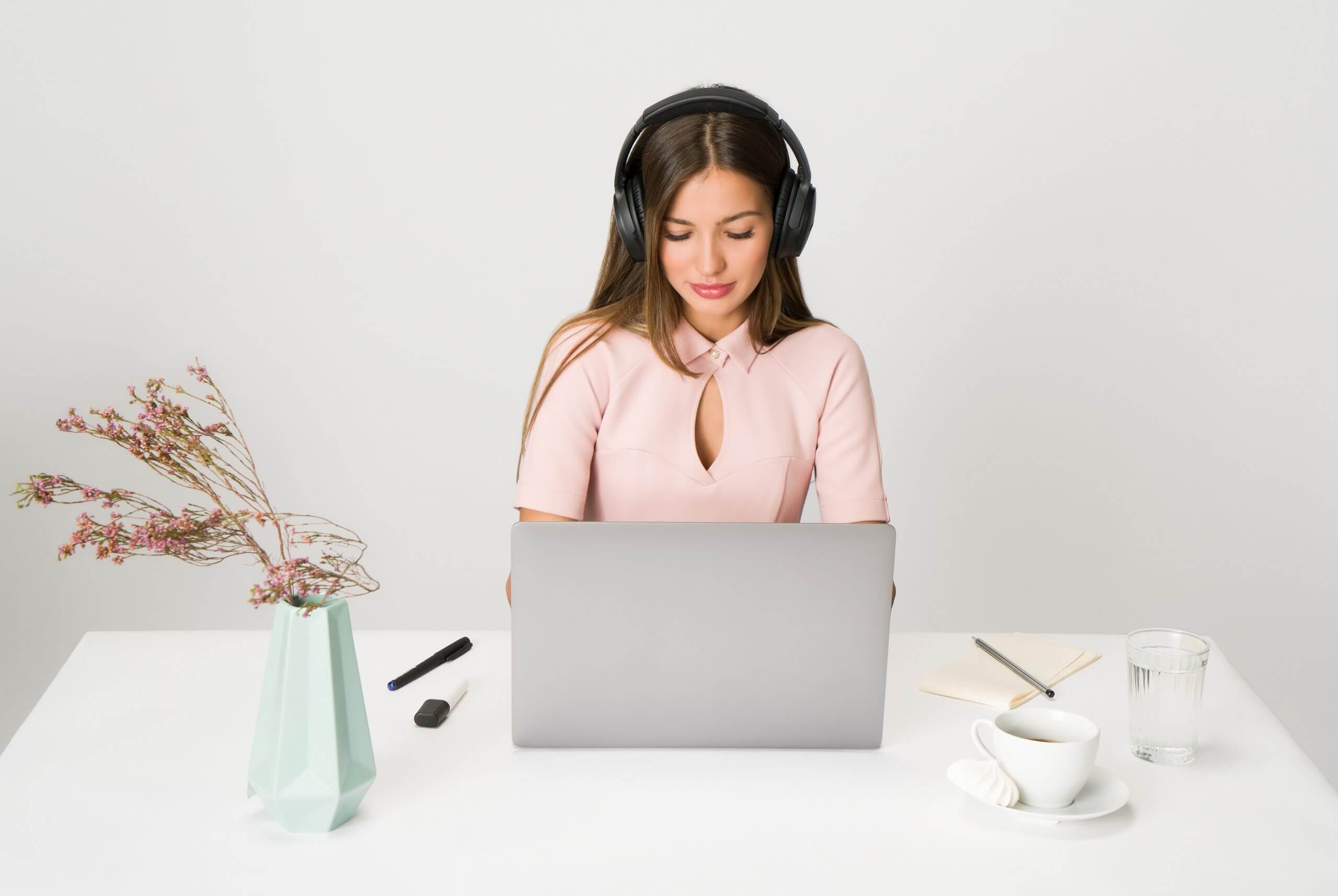 create social media posts, social media content, converting content, how to make effective social content - woman in pink with headphones in