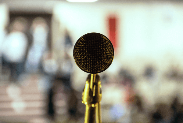 top social media influencers list - a microphone on a blurry screen