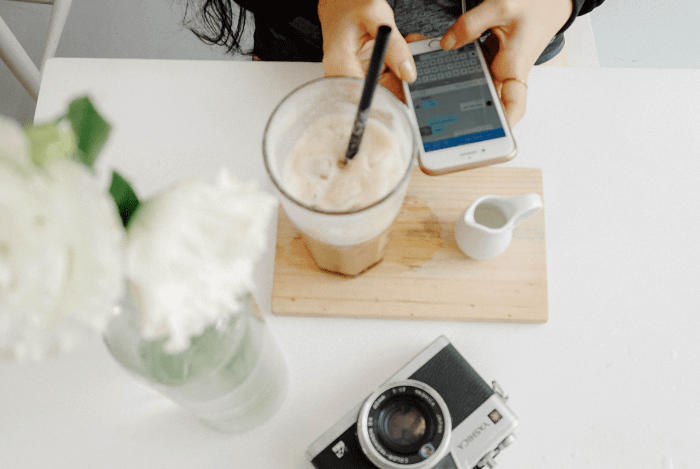 Person on phone and latte coffee Instagram Dynamic ads