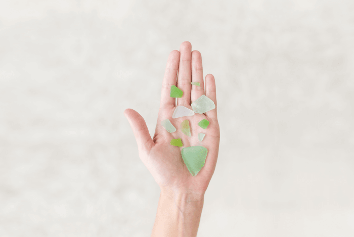pr crisis hand with shaken pieces of glass