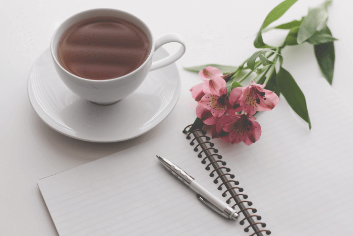 story brand pen notebook coffee flower