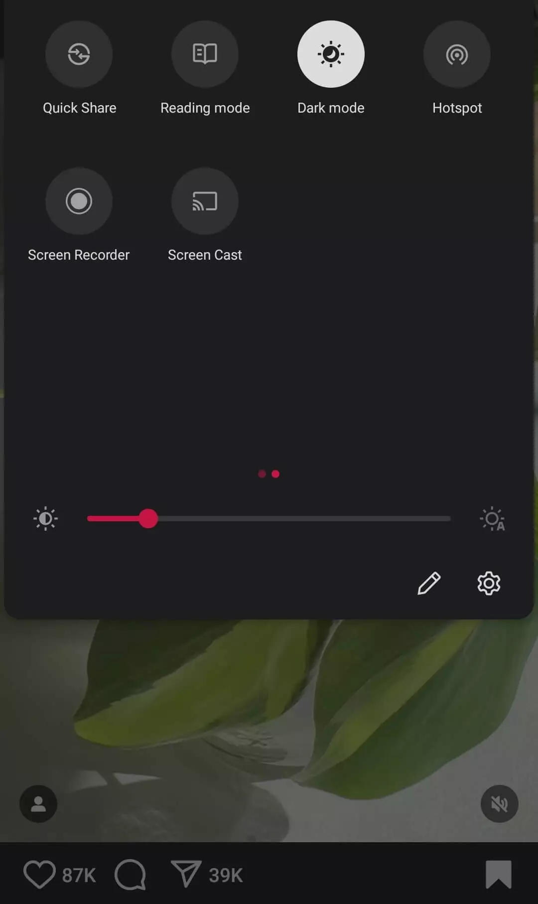 A phone screen displaying quick settings options like Quick Share, Dark mode, Hotspot, and brightness adjustment with a slider.