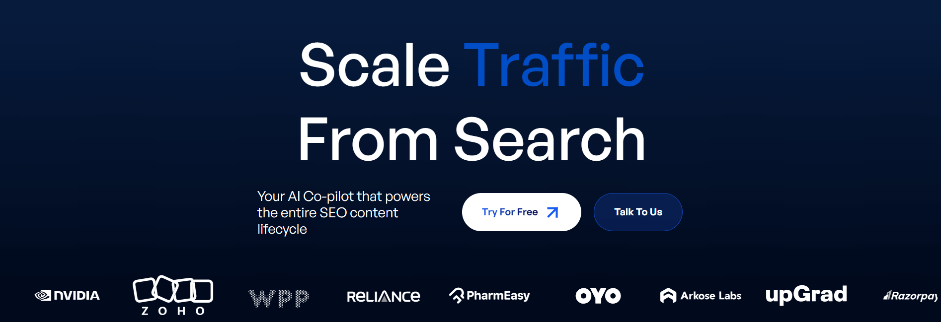 "Scale traffic from search" header promoting an AI-powered SEO content tool. Logos of notable brands like NVIDIA, Zoho, and Reliance displayed.