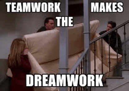 Three people struggling to move a couch upstairs with the text "Teamwork makes the dreamwork" humorously highlighting collaboration.