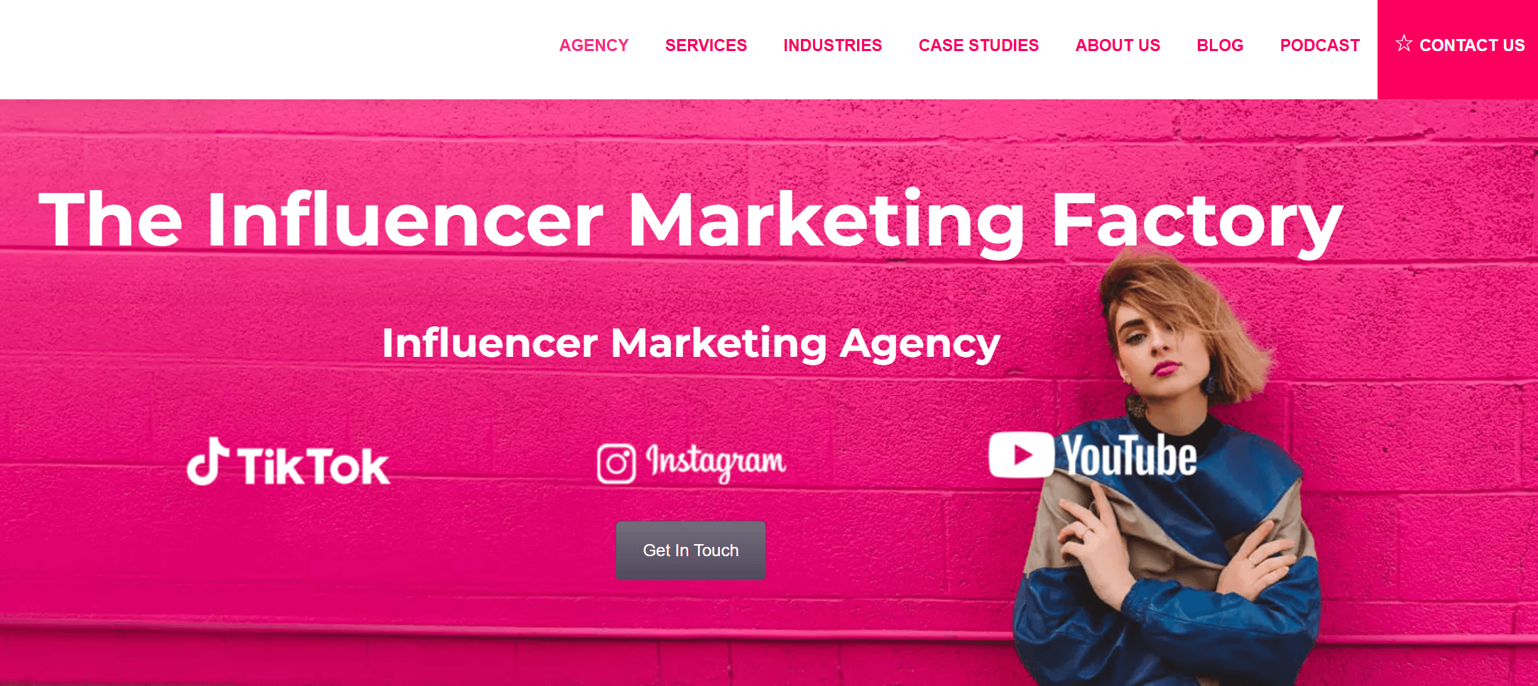 Homepage of The Influencer Marketing Factory featuring a stylish woman against a pink wall, with TikTok, Instagram, and YouTube logos.