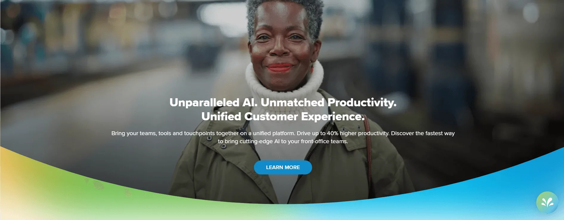 Sprinklr's homepage showing a smiling woman in a blurred urban setting with text highlighting AI-driven productivity and unified customer experience benefits.