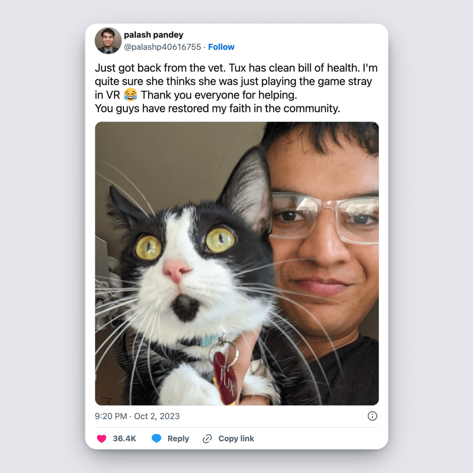 Man holds cat named Tux after vet visit, joking she thought her adventure was a VR game; grateful community post.