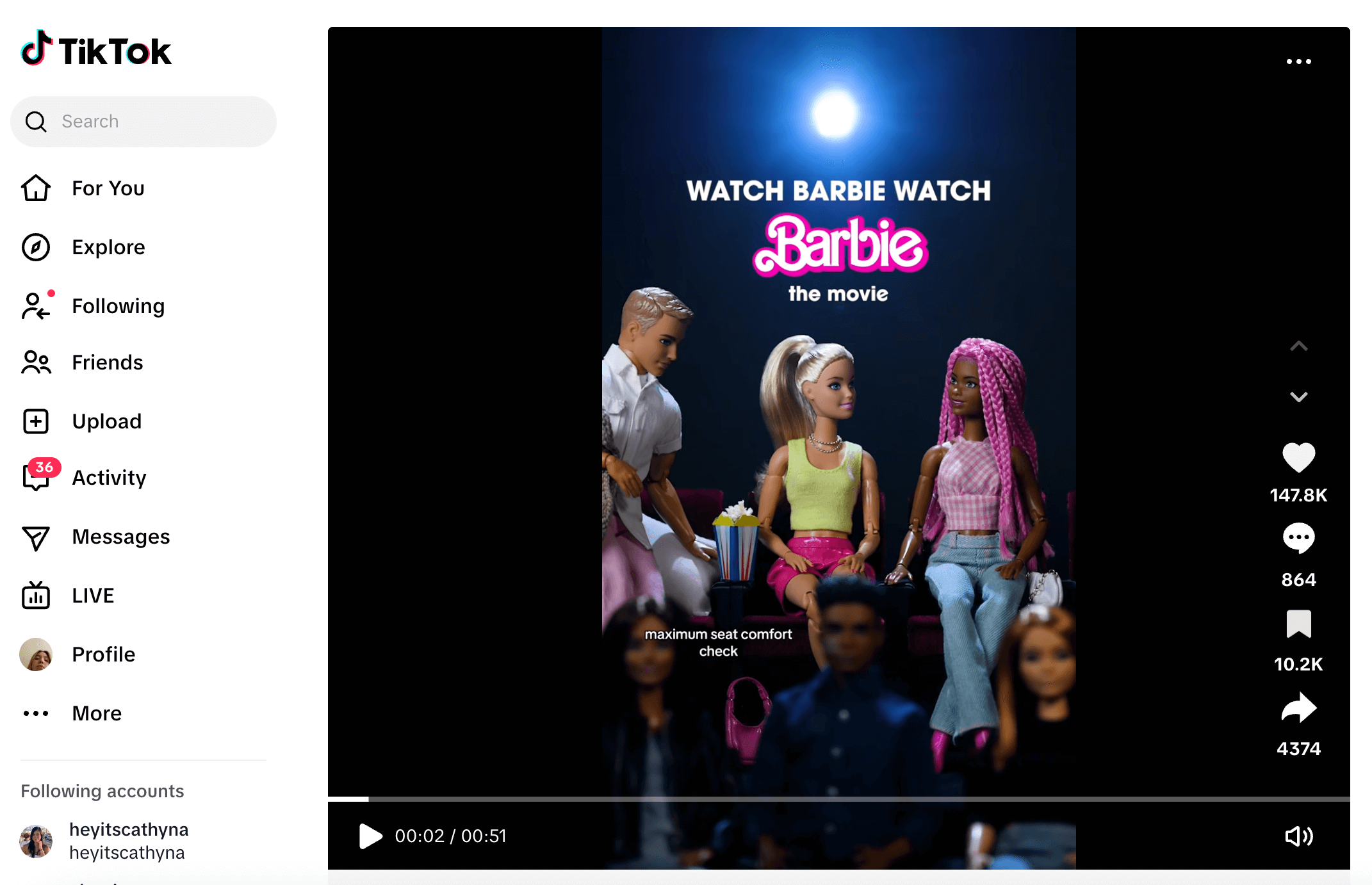 Barbie dolls watching a movie in a TikTok clip promoting “Watch Barbie Watch Barbie the Movie.”