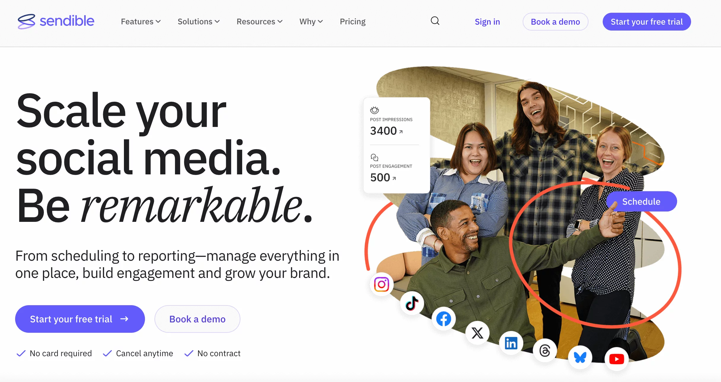 Diverse marketing team celebrating social media growth with Sendible's analytics and social media scheduling tools.
