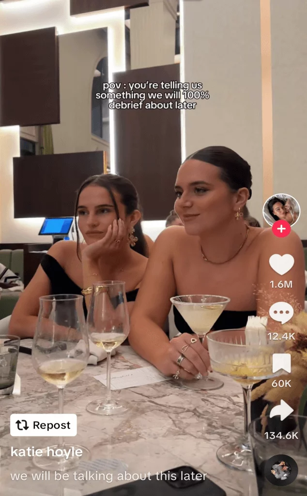 TikTok post of two women engaged in conversation, captioned 'pov: you're telling us something we will 100% debrief about later'.