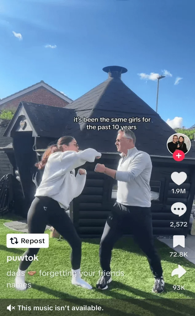 TikTok post of a father and daughter pretending to fight in the garden.