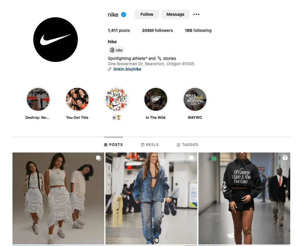 Nike's Instagram profile showcasing posts featuring models in white outfits, denim fashion, and a hoodie with text.