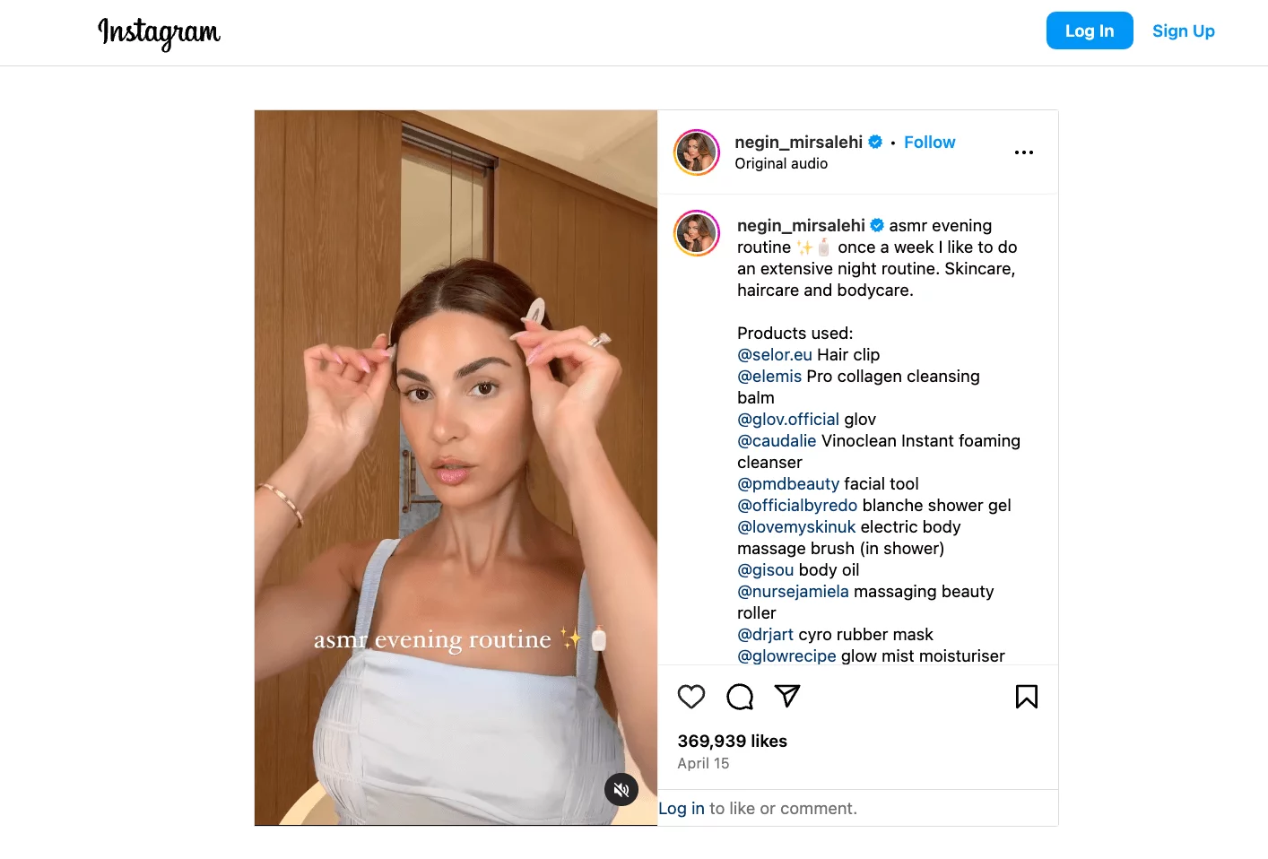 Negin Mirsalehi gently clips her hair back as part of her ASMR evening skincare and beauty routine in her reel. Text overlay reads, "ASMR evening routine."