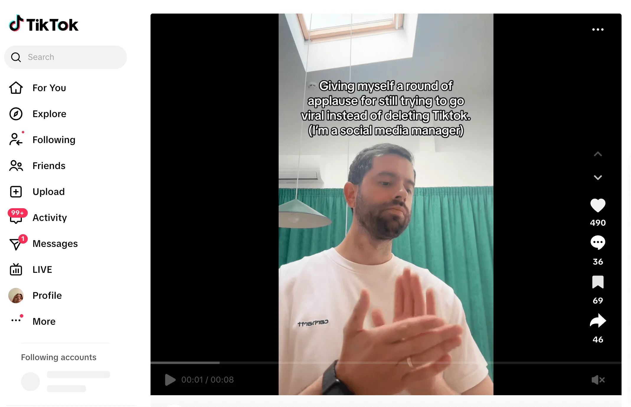 George clapping with text about trying to go viral instead of quitting TikTok as a social media manager.