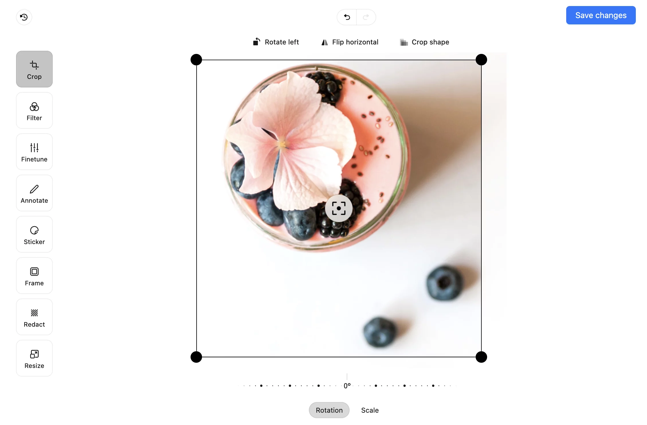 Image cropping tool in Planable with smoothie bowl photo and editing options like rotate, flip, and crop